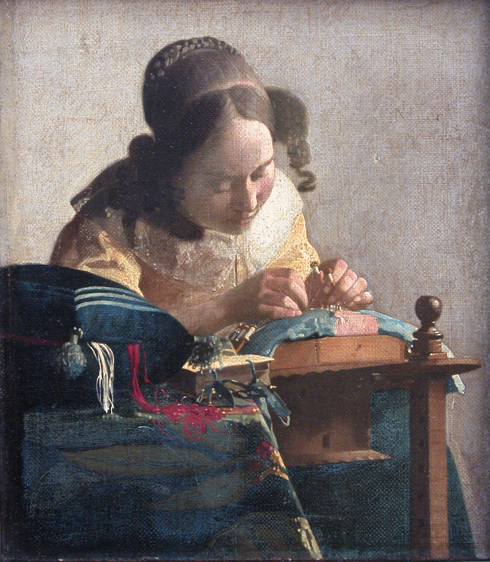 Schilderij 'De kantwerkster' van Johannes Vermeer